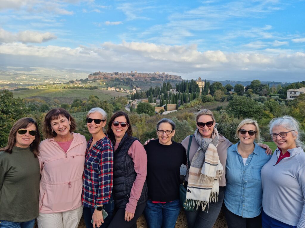 Liz with a tour group with Orvieto in the distance