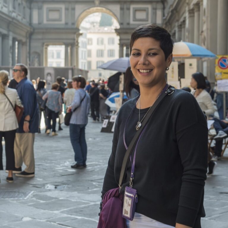 Woman posing in front of archway in Florence