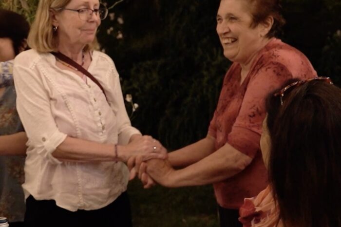 Happy guests dinner party franca shaking hands in Umbria