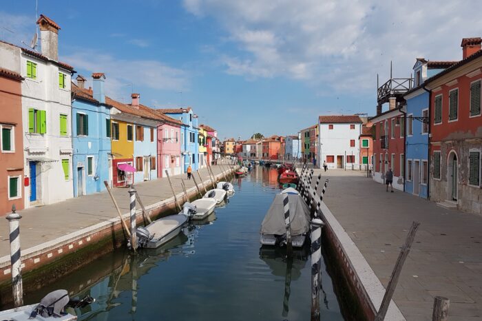 Boats line a canal on Burano Island
