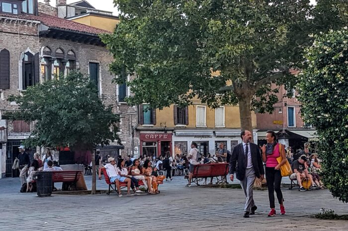 People strolling in a piazza in Venice