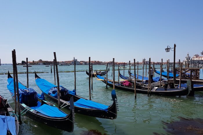 Gondolas lined up at a dock in Venice