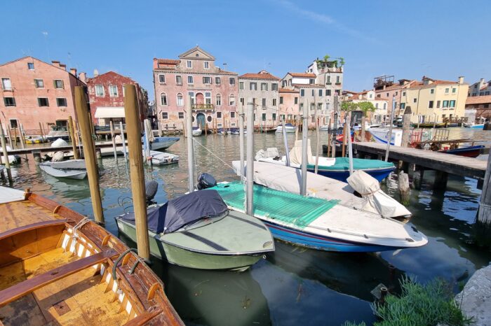Boats lining a dock in Venice