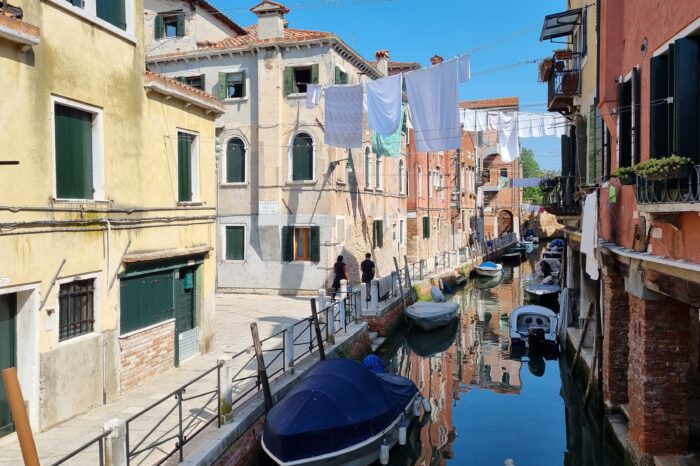 Sheets Hung to dry over a canal in Venice