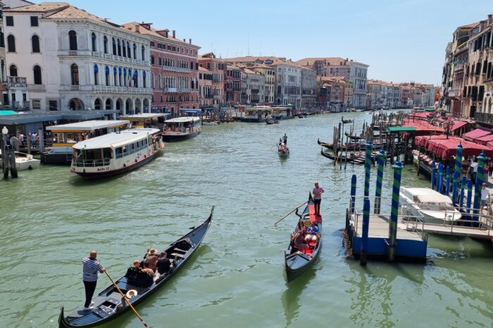 Gondolas venturing down a Venetian canal