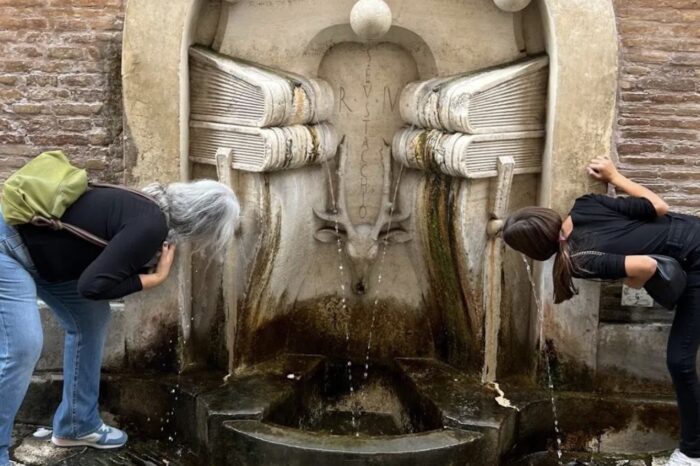 Drinking out of water fountain in rome