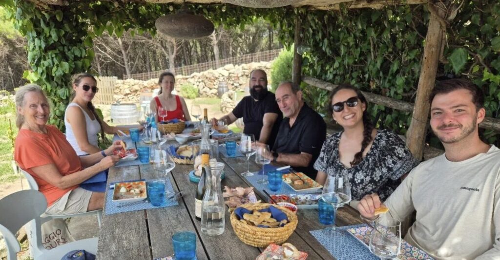 people at picnic table, outdoor dining